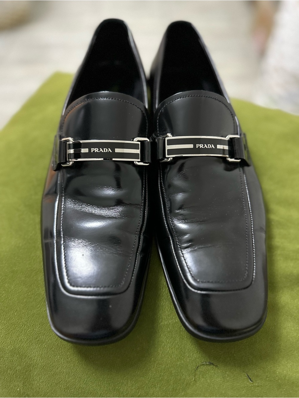Prada Black Patent Leather Slip-On Loafers with Logo Bar